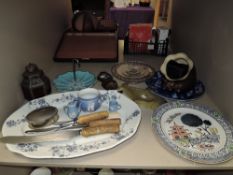 An assortment of items including midwinter bon bon dish, platter, cow bell and more.