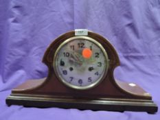 An inlaid wooden mantel clock