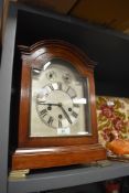 An Edwardian bracket clock having mahogany case with Westminister chime