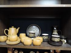 A collection of retro pottery including Denby, cups and saucers, plates and more.