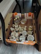 A mixed box of ceramics including crested ware and German cups.