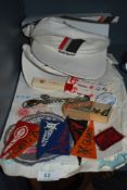 A selection of vintage sports memorabilia including miniature baseball pendants and Audi sports cap
