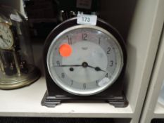 A mid century 8 day bakelite mantel clock