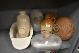 A selection of various foot warmers and hot water bottles