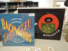 Two board games including vinatage roulette.