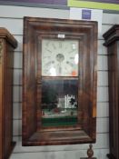 An American 30 hour wall clock by Rome and Co, New haven, Connecticut with enamel face