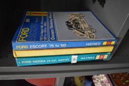Three motor car workshop manuals including Ford Escort and Cortina