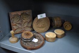 A selection of various biscuit press molds and similar chocolate mold having fruit and harvest