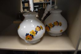 A pair of vintage lamp shades.