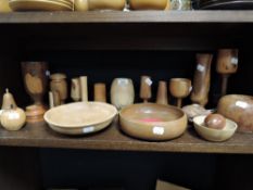 A selection of treen amongst which are bowls and vases.