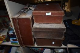 Four vintage cases.