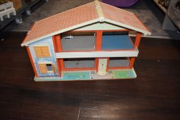 A vintage mid century dolls house