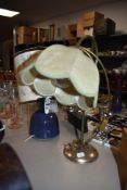 A ceramic studio pottery lamp base with flambe glaze and similar metal table lamp