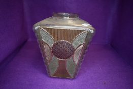 An early 20th century light shade in a lantern shape with decorated glass