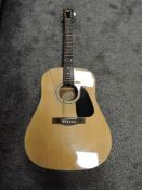 An acoustic fender guitar.