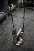 An antique camber stick and a pair or similar wrought iron candle stems