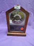 An American wood framed mantel clock