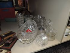 An assortment of cut and pressed glass including vases, bowls and more.