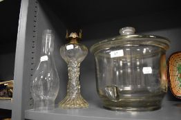 A large lidded crisp or sweet jar and a similar cut glass lamp