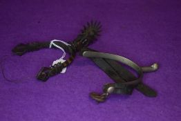 Two horse riding spurs one traditional design and similar middle eastern or Islamic style