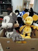 A box of Disney soft toys.