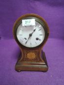 An early 20th century balloon clock having inlaid detail to front,AF.