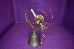 A vintage shop or door bell having spring mechanism