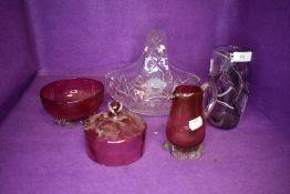 An art glass vase, a similar clear cut crystal flower vase and two pieces of cranberry glass