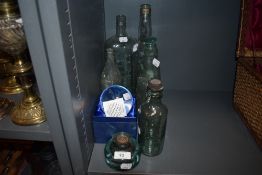 A selection of vintage advertising bottles including Tippers Vitals and Ed Hayton Kendal