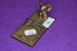 A novelty brass mouse trap