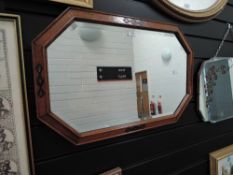 An oak framed bevel edged mirror