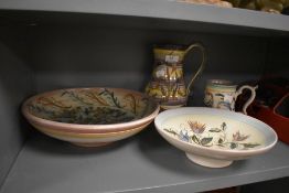 Four pieces of early Denby pottery in the Glynn ware range having hand decorated floral grounds