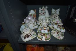 Ten ceramic model figure studies of cottages and buildings by Coalport all in fine condition