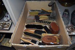 A selection of vintage shoe and clothes brushes.