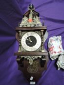 A reproduction 8 day wall clock weight driven