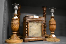 An Ollivant and Botsford of Manchester mantle clock and two pairs or similar oak candle sticks