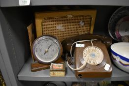 A selection of hardware including brown telephone and portable radio