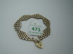 A 9ct gold gate bracelet of decorative brick link form having padlock clasp. Approx 7.5g