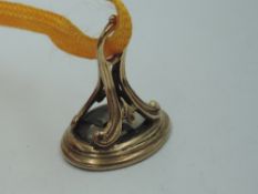 A rose metal fob having carved intaglio depicting a dove of peace with Latin text: Pax Et Amor, GW