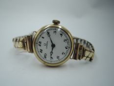 A lady's 9ct gold vintage wrist watch by Omega, no: 9117101, having an Arabic numeral dial to