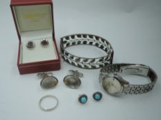 A small selection of silver and white metal jewellery including two pairs of stud earrings, a band