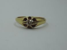 An 18ct gold signet ring having an old cut diamond, approx 0.25ct in a star burst setting, size