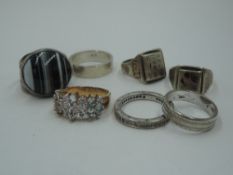 A selection of HM silver and white metal rings including striped agate, Middle Eastern engraved