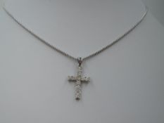 An 18ct white gold diamond set cross pendant with chain, approx 15' & 4.9g