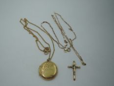 A 9ct gold paperlink chain with broken yellow metal crucifix pendant, and a gold plated circular