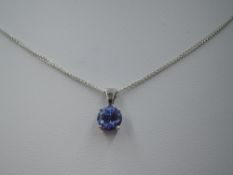 A tanzanite pendant, approx 1ct in a four claw set 18ct white gold mount with chain, approx 18' &