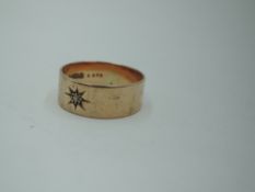 A 9ct rose gold wedding band having an inset rough cut diamond chip in star burst setting, Chester