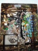 A selection of costume jewellery including yellow wire and bead necklaces, clip earrings, wrist