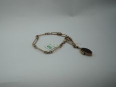 A 9ct rose gold fancy link watch chain with lozenge shaped fob (AF) and dog leash clasp, approx