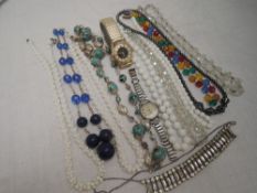 A small selection of vintage beads including diamante and yellow wire and two vintage wrist watches
